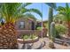 Charming desert landscape with palm trees and native cacti enhancing the curb appeal at 42293 W Good Vibrations Ln, Maricopa, AZ 85138