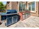 Built-in outdoor grill and smoker with stainless steel storage, perfect for backyard cooking at 42293 W Good Vibrations Ln, Maricopa, AZ 85138