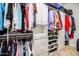 Well-organized walk-in closet featuring shelving, hanging space, and shoe storage at 42293 W Good Vibrations Ln, Maricopa, AZ 85138