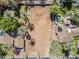 Aerial view of a vacant lot surrounded by mature trees, with neighboring homes and swimming pools at 4419 N 46Th Pl, Phoenix, AZ 85018
