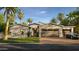 Beautiful stone accented exterior with a three car garage, desert landscaping, and modern design at 4419 N 46Th Pl, Phoenix, AZ 85018