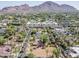 Aerial view of a tree-lined neighborhood street with mountain views and nice homes at 4419 N 46Th Pl, Phoenix, AZ 85018