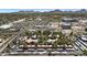 Expansive aerial view of the property nestled amidst lush greenery with mountain views in the background at 4704 E Paradise Village N Pkwy # 236, Phoenix, AZ 85032