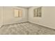 A bright and cozy bedroom featuring natural light and neutral carpet at 4704 E Paradise Village N Pkwy # 236, Phoenix, AZ 85032