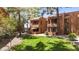 Well-maintained exterior with lush landscaping and private patios and balconies at 4704 E Paradise Village N Pkwy # 236, Phoenix, AZ 85032
