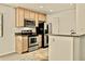 Efficient kitchen featuring sleek stainless steel appliances, granite counters, and ample cabinet space at 4704 E Paradise Village N Pkwy # 236, Phoenix, AZ 85032