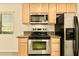 A well-appointed kitchen with stainless steel appliances and ample counter space at 4704 E Paradise Village N Pkwy # 236, Phoenix, AZ 85032