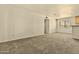 A spacious living room with neutral carpet, a window, and plenty of natural light at 4704 E Paradise Village N Pkwy # 236, Phoenix, AZ 85032