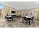 Bright community lounge area with fireplace, cozy chairs and large tables, ideal for relaxation and social interaction at 4704 E Paradise Village N Pkwy # 236, Phoenix, AZ 85032