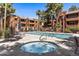 Inviting community pool and spa area with lounge chairs and shade umbrellas at 4704 E Paradise Village N Pkwy # 236, Phoenix, AZ 85032