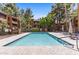 Serene community swimming pool with lounge chairs and lush landscaping for a relaxing atmosphere at 4704 E Paradise Village N Pkwy # 236, Phoenix, AZ 85032
