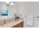 Clean bathroom featuring elegant finishes, stone counters, and a large decorative mirror at 4747 N Scottsdale Rd # 4003, Scottsdale, AZ 85251