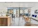 Bright open-plan living area with modern decor and large windows leading to a balcony at 4747 N Scottsdale Rd # 4003, Scottsdale, AZ 85251