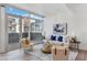 Bright living room with a sofa and armchairs, complemented by a large window and stylish decor at 4747 N Scottsdale Rd # 4003, Scottsdale, AZ 85251