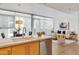 Open floor plan showcasing a kitchen island, dining area, and living room with ample natural light at 4747 N Scottsdale Rd # 4003, Scottsdale, AZ 85251