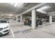 An expansive parking garage featuring reserved parking spots and electric vehicle charging stations at 4747 N Scottsdale Rd # 4003, Scottsdale, AZ 85251