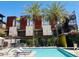 The blue swimming pool is near a grilling station and outdoor seating area at 4747 N Scottsdale Rd # 4003, Scottsdale, AZ 85251