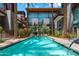 Inviting community pool, lined with palm trees and lush desert landscaping, offers a serene oasis at 4747 N Scottsdale Rd # 4003, Scottsdale, AZ 85251