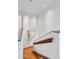 Contemporary staircase featuring wood treads and a white banister at 4747 N Scottsdale Rd # 4003, Scottsdale, AZ 85251