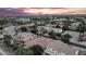 Aerial view of a residential area featuring spacious homes, mature trees and mountain views at 4756 E Ironhorse Rd, Gilbert, AZ 85297