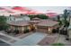 Beautiful single-story home with a well-manicured yard and a tile roof against a colorful twilight sky at 4756 E Ironhorse Rd, Gilbert, AZ 85297