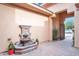 Charming fountain in the front patio with a brick floor in a neutral stucco patio at 4756 E Ironhorse Rd, Gilbert, AZ 85297