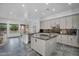 Spacious kitchen featuring dual islands, stainless steel appliances, and granite countertops at 4756 E Ironhorse Rd, Gilbert, AZ 85297