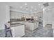 Open kitchen with stainless steel appliances, granite countertops, and a breakfast bar at 4756 E Ironhorse Rd, Gilbert, AZ 85297