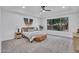 Inviting main bedroom with a large window, a decorative tapestry, and stylish bedside tables with lamps at 4756 E Ironhorse Rd, Gilbert, AZ 85297