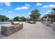 Outdoor kitchen area with stone grill and counterspace near the community pool and seating areas at 4756 E Ironhorse Rd, Gilbert, AZ 85297