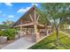 Open-air community pavilion with wood beams and stone pillars, offering a shady spot for picnics and gatherings at 4756 E Ironhorse Rd, Gilbert, AZ 85297