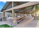 Picnic area featuring wood tables and benches under a covered pavilion in the community at 4756 E Ironhorse Rd, Gilbert, AZ 85297