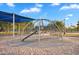 Community playground with a climbing structure and slide set on a soft sand base at 4756 E Ironhorse Rd, Gilbert, AZ 85297