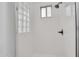 Bright shower stall featuring glass block window and modern fixtures at 4756 E Ironhorse Rd, Gilbert, AZ 85297