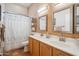 Bathroom features double sinks, and neutral accents, combining style and functionality for a comfortable and inviting space at 4819 E Villa Theresa Dr, Scottsdale, AZ 85254