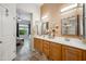 Ensuite bathroom boasts double sinks, plenty of storage, and a well-lit space, offering a relaxing and functional experience at 4819 E Villa Theresa Dr, Scottsdale, AZ 85254