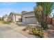 Charming single-story home with desert landscaping, a two-car garage and a tiled roof at 4819 E Villa Theresa Dr, Scottsdale, AZ 85254