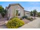 Single-story home featuring desert landscaping, including cacti, flowering bushes, and rock ground cover at 4819 E Villa Theresa Dr, Scottsdale, AZ 85254