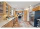Spacious kitchen featuring stainless steel appliances, tile floors, and warm wooden cabinetry for a comfortable atmosphere at 4819 E Villa Theresa Dr, Scottsdale, AZ 85254