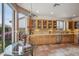 Bright kitchen with a breakfast nook, tile floors, stainless steel appliances, and light wood cabinets at 4819 E Villa Theresa Dr, Scottsdale, AZ 85254