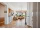 Open-concept living room with tile flooring, tan walls, a leather couch, and lots of natural light at 4819 E Villa Theresa Dr, Scottsdale, AZ 85254