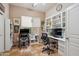 Functional office space with built-in shelving, a window, and two workstations at 4819 E Villa Theresa Dr, Scottsdale, AZ 85254