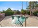 Relaxing community spa pool area with a safety handrail, surrounded by desert landscaping and beautiful neighborhood views at 4819 E Villa Theresa Dr, Scottsdale, AZ 85254