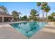 Community pool with marked lap lanes, lounging chairs, covered picnic area, and a spacious deck at 4819 E Villa Theresa Dr, Scottsdale, AZ 85254