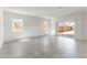 Open living area features tile flooring, abundant natural light, and access to the backyard through sliding glass doors at 5053 E Umber Rd, San Tan Valley, AZ 85143