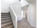 Bright staircase with carpeted steps leading to the open-concept layout, featuring neutral tile floors at 5053 E Umber Rd, San Tan Valley, AZ 85143