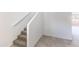 Carpeted staircase features a white handrail complementing the walls in this modern home at 5053 E Umber Rd, San Tan Valley, AZ 85143