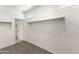 This large walk-in closet has carpeting, shelving, and closet rod and plenty of room for storage at 5053 E Umber Rd, San Tan Valley, AZ 85143
