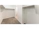 This large walk-in closet has carpeting, shelving, and closet rod and plenty of room for storage at 5053 E Umber Rd, San Tan Valley, AZ 85143