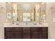 The bathroom features a double sink vanity with a large, mirrored wall at 6482 S Claiborne Ave, Gilbert, AZ 85298